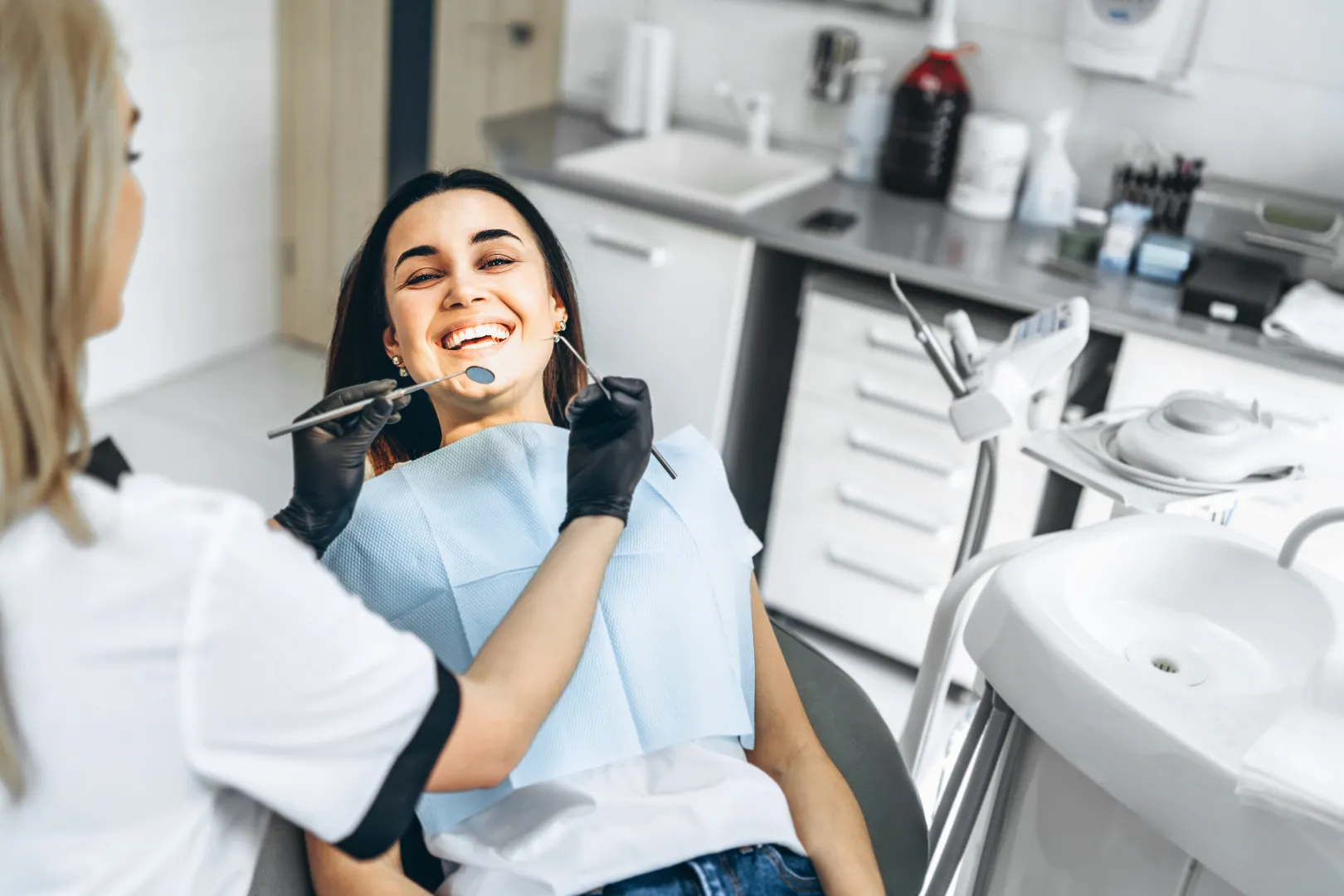 Patient smiling during dental exam at Isom Dentistry