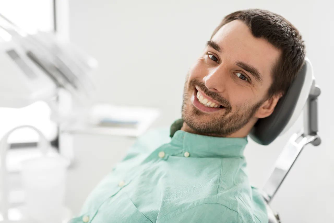 A patient relaxed in the chair after bone grafting treatment