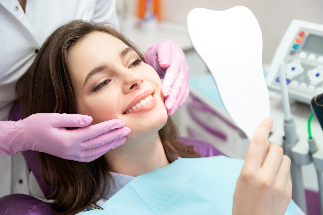 A patient smiling after her cosmetic dentistry treatment