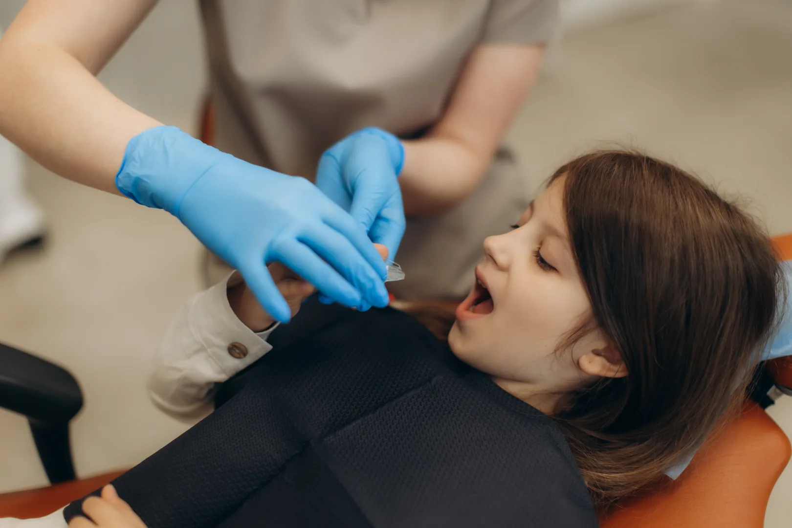A young patient having fluoride applied during a routine checkup