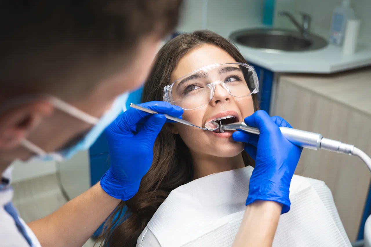 A patient being examined for the signs that point to a root canal